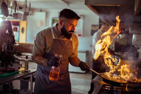 Chef Performing a Flambe in the Kitchen