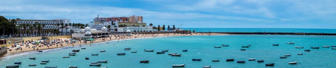 Boats on La Caleta beach in Cadiz, Spain
