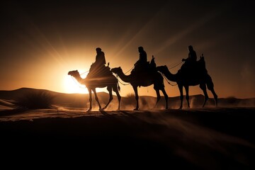 The three wise men on their camels traveling through the desert with the sun reflecting behind their shadows - obrazy, fototapety, plakaty