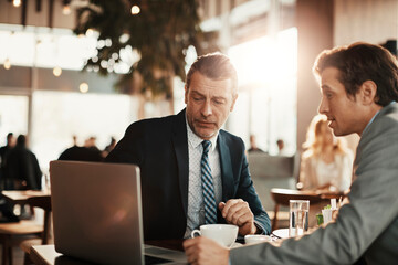 Business partners talking in a coffee shop