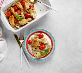 Vegetarian menu. Stewed beans with tomato, spices and bread. In a color plate. Top view.