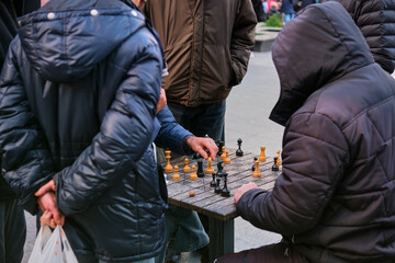 Ukrainian men playing chess in a park, Trukavets, Lviv region, Ukraine