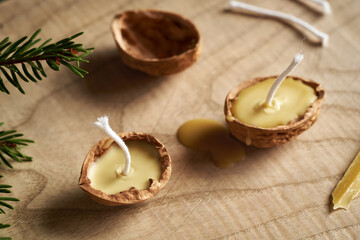 Preparation of Christmas candles from bees wax and nut shells