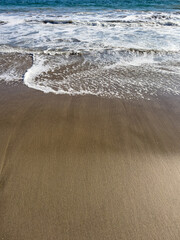 wave on the beach sand
