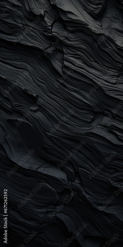 Poster a detailed close up of a black rock wall. this image can be used in various projects that require te