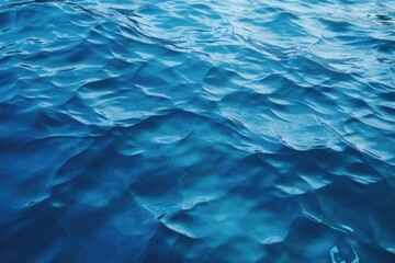 Obraz premium A detailed view of a body of water, capturing its texture and movement. This image can be used to represent nature, tranquility, or the beauty of water in various applications