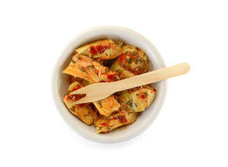 artichokes salad with vegetable mix sauce dressing in a bowl isolated on white background.