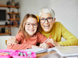 grandchild grandmother family granddaughter child teacher homework creativity home woman book...