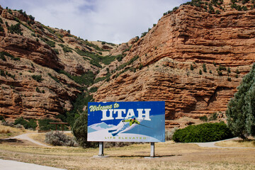 Utah sign with red mountains in the background. Red Canyons in the USA. Beautiful landscape with red high mountains