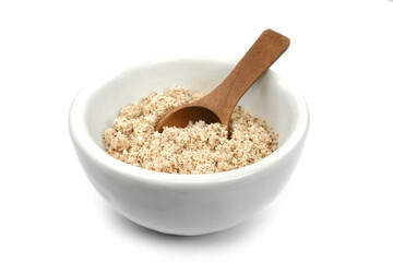 Shelled and ground almond nuts in wooden bowl. Edible, dried, brown seeds of Prunus dulcis. Ingredient in marzipan, nougat, cookies. Isolated macro food photo close up from above on white background.