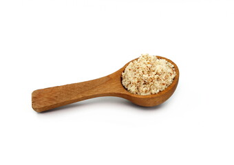 Shelled and ground Ground, milled, crushed almond nuts in a wooden spoon isolated on white. Edible, dried, brown seeds of Prunus dulcis. Ingredient in marzipan, nougat, cookies.
