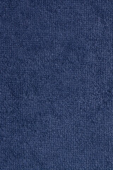 Dark blue terry cloth. The texture is blue fabric. Background terry fabric blue