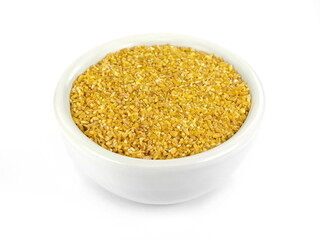 Raw Bulgur in a bowl Isolated on a white background. Raw bulghur, dry cracked parboiled wheat groats, cereal 