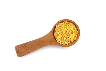 Wooden spoon with uncooked bulgur isolated on white