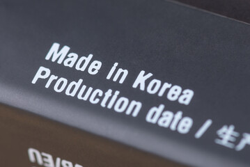 Fototapeta premium Made in Korea inscription on black box. Production of goods in Korea concept