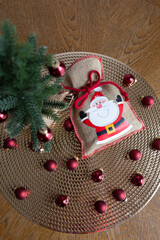 bag with a gift under the Christmas tree, New Year card