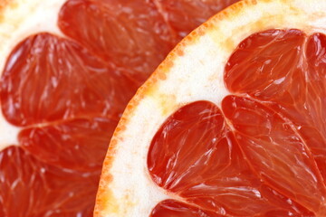 Juicy red grapefruit macro image. Macro red grapefruit texture background.