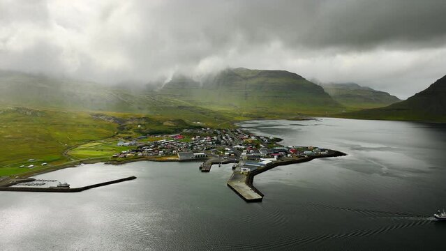 Small Town Near Kirkjufell Mountain in Iceland, Rain Clouds Over Volcanic Hills, Scenic Nature Landscape