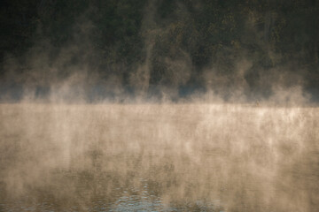 Dense mist rising off the surface of the Catawba River in South Carolina