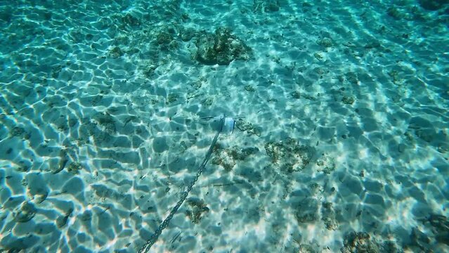 An anchor on the ocean floor in Cayman Islands.