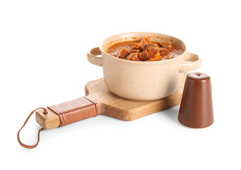 Pot of tasty cream soup with croutons on white background
