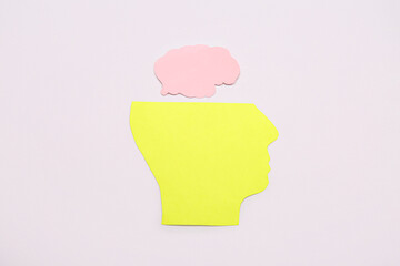 Paper human head with brain on grey background. Mental Health Day