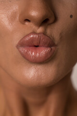 Naklejka premium Cosmetics and skin care. Portrait of beautiful woman pucker lips, kissing