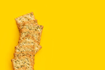 Seaweed crackers on yellow background.