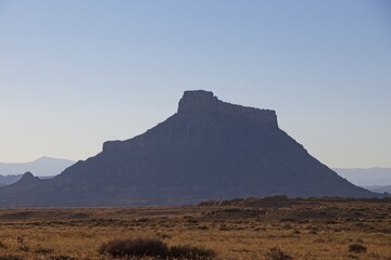 The landscape in Southern Utah is one of the most unique and otherworldly scenes in the United States. Pictured here is the Factory Butte, a notable landform in the area.