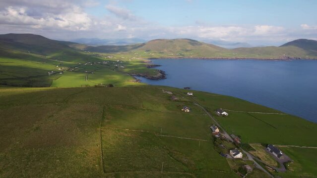 IRELAND- 8.27.2023 -Excellent aerial footage roving over green fields towards the cliffs of Kerry in Ireland.