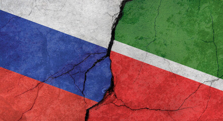 Flags of Russia and Tatarstan, texture of concrete wall with cracks, grunge background, military conflict concept