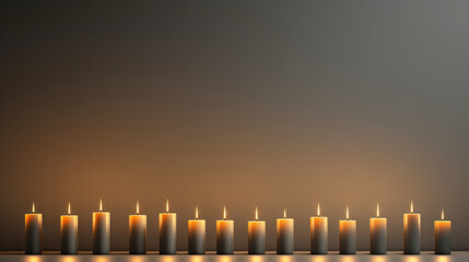 A row of lit candles sitting on top of a table