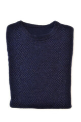 folded blue wool crewneck sweater on white background