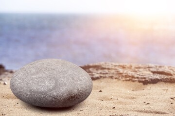 Fototapeta na wymiar Summer sand and sea background with stone podium