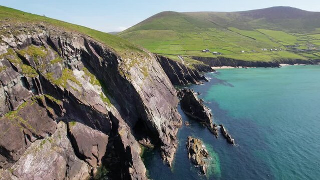 IRELAND- 8.27.2023 -Excellent aerial footage panning from the green coast of Dingle, Ireland to the ocean.