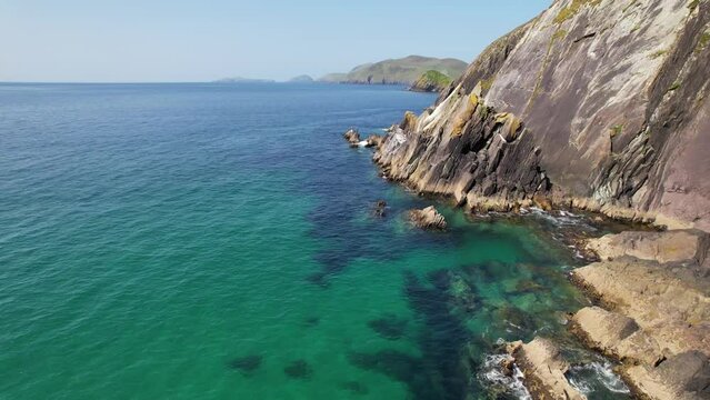 IRELAND- 8.27.2023 -Excellent aerial footage moving along the rocky shoreline of Dingle, Ireland.