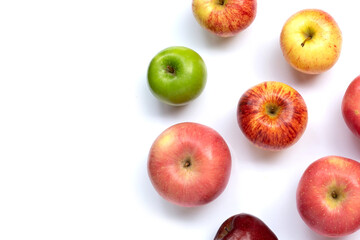 Variety of fresh apples on white background.