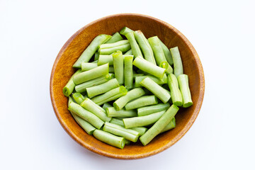 Green beans on white background.
