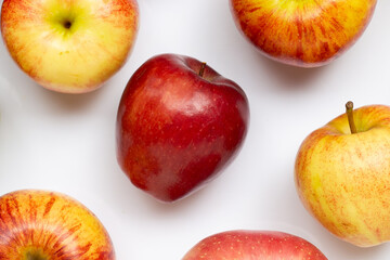 Variety of fresh apples on white background.