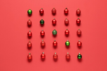 Composition with different Christmas balls on red background