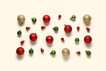 Composition with different Christmas balls on light background