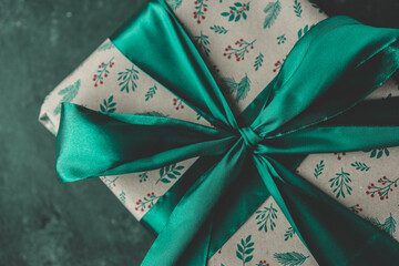 Christmas gift with a big bow close-up