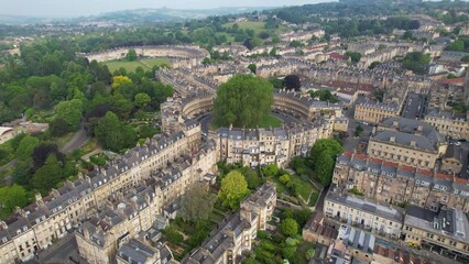 BATH- 8.27.2023 -Excellent aerial footage circling clockwise around The Circus ring of housing in Bath, England.