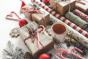 Christmas gifts and wrapping paper top view