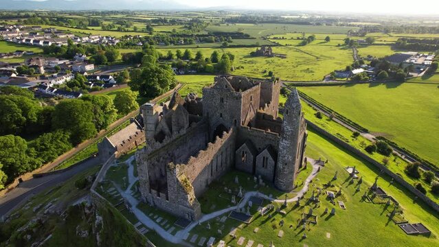IRELAND- 8.27.2023 -Excellent aerial footage circling around Ireland's Rock of Cashel and its adjoining graveyard.