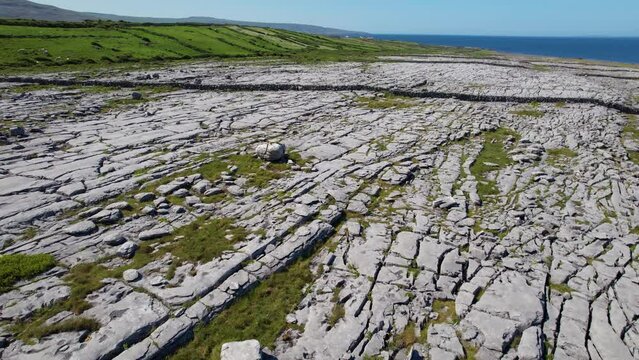 IRELAND- 8.27.2023 -Excellent aerial footage moving over The Burren in Ireland, towards green hills.