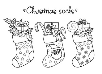 Outline cartoon Christmas winter socks for holiday design. Traditional Xmas stockings with gift boxes, candy, gingerbread, mistletoe. Vector contour illustrations perfect for New Year coloring page.