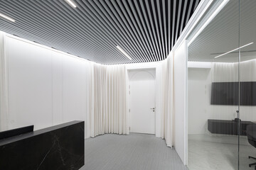 Modern reception area with striped ceiling