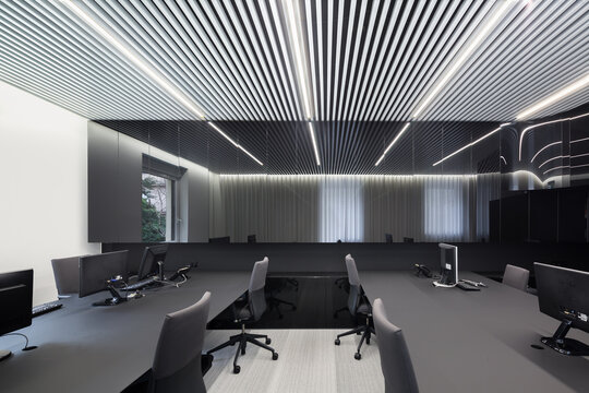 Modern office with linear ceiling lighting