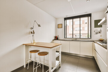 Kitchen with white cabinets and wooden furniture